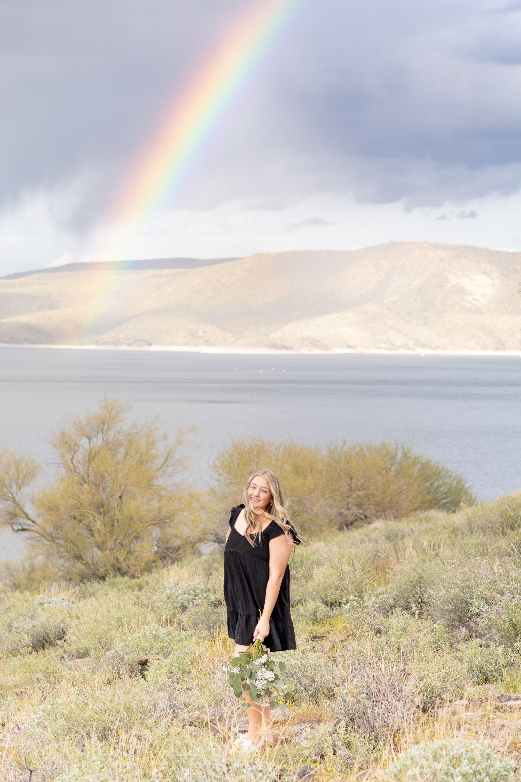 Rainbow over Lake Pleasant at a senior photography session in Arizona.