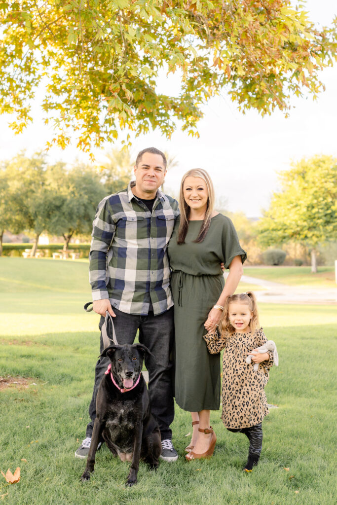 Family of three with dog during fall family mini session in Peoria, AZ.