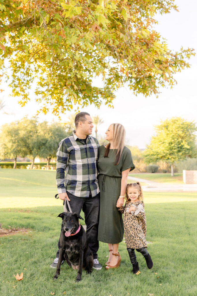 Family of three with dog during fall family mini session in Peoria, AZ.