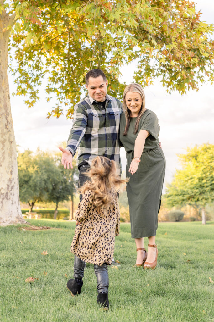 Family of three during fall mini session in Peoria, AZ.