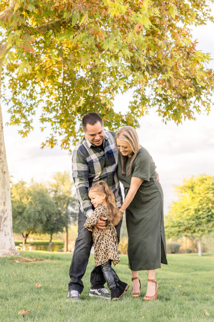 Family of three during fall mini session in Peoria, AZ.