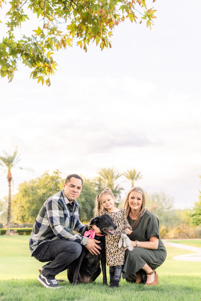 Family of three with dog during fall family mini session in Peoria, AZ.